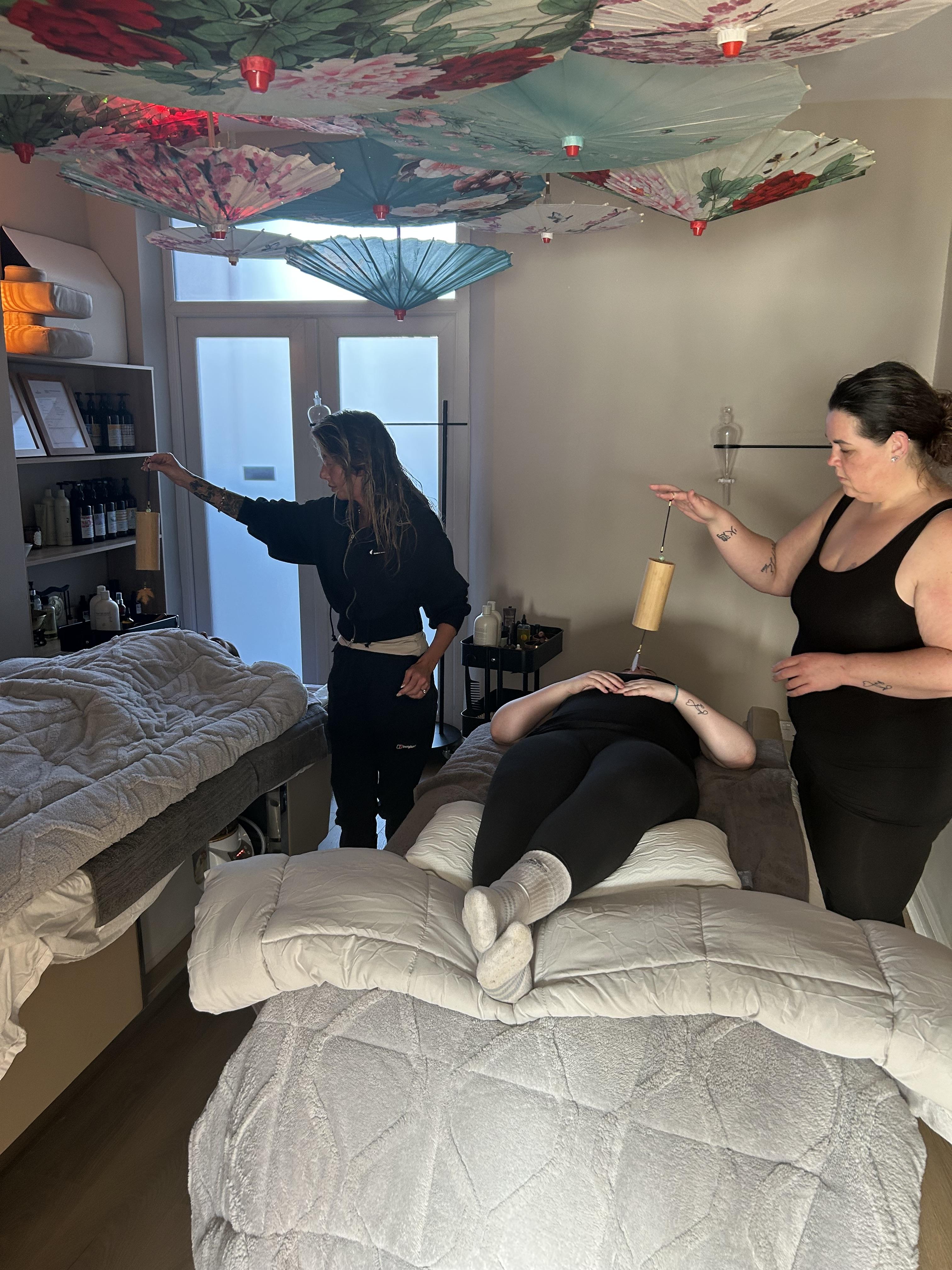 Students practising sound therapy techniques during holistic Japanese Head Spa training