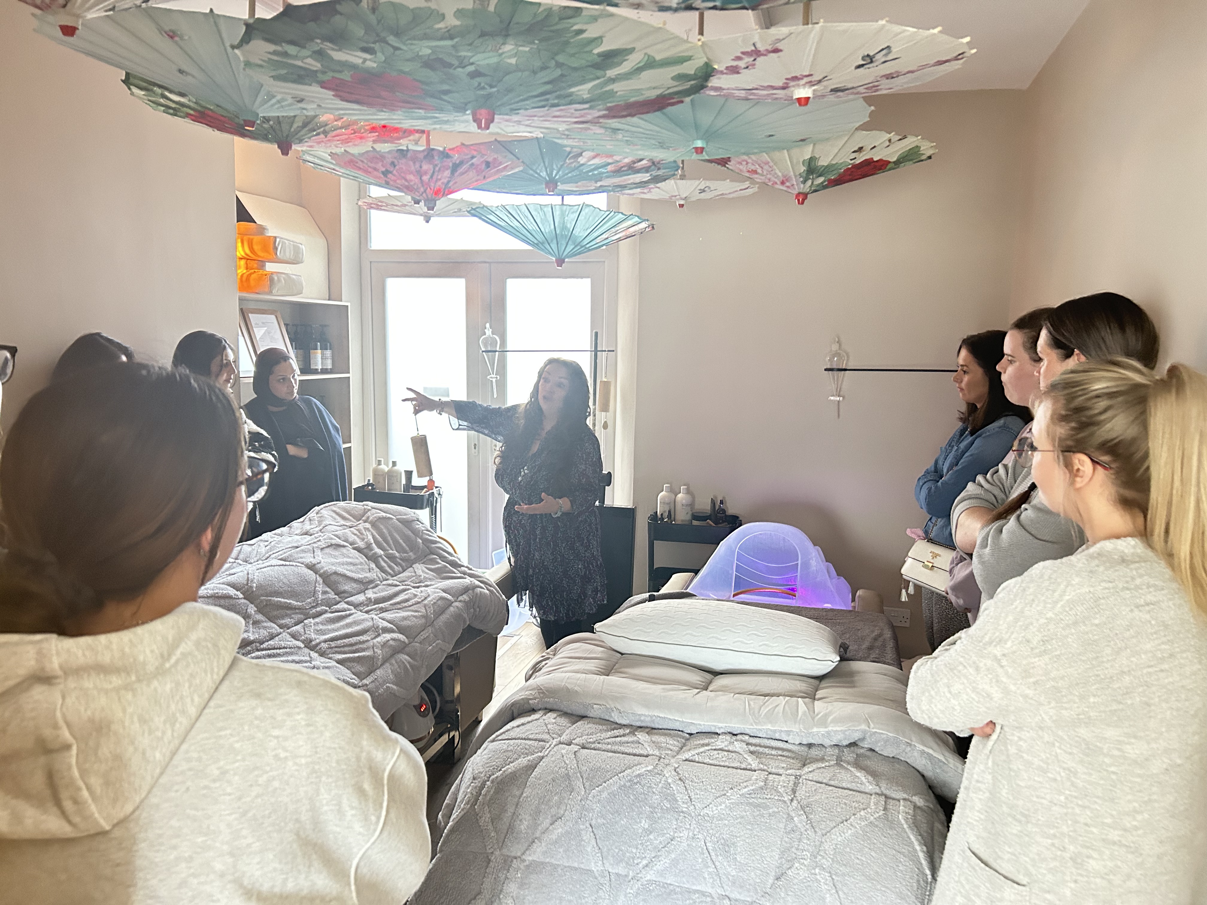 Students watching a practical Japanese Head Spa training demonstration in Manchester